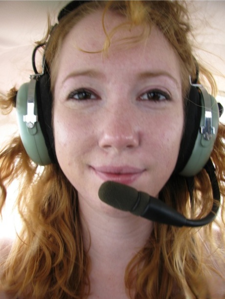Natural redhead Nicki Blue gets totally natural aboard a small engine aircraft