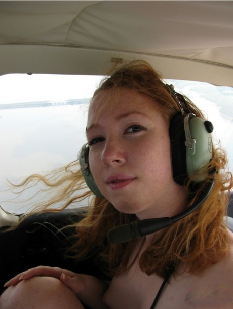 Natural redhead Nicki Blue gets totally natural aboard a small engine aircraft