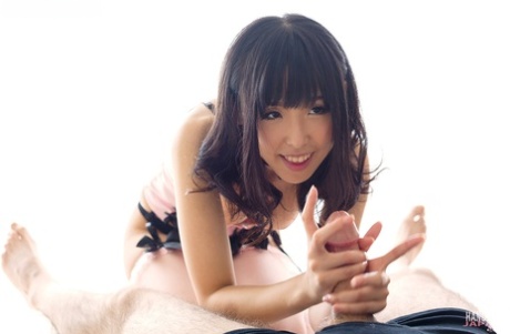 Alluring Japanese girl in attractive lingerie tastes climax after giving a manual stimulation