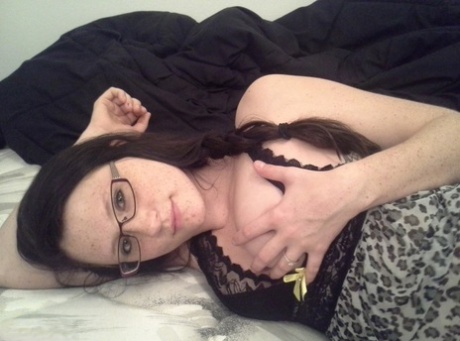 Geeky brunette Freckles 18 touches her attractive breasts in her solo homemade session