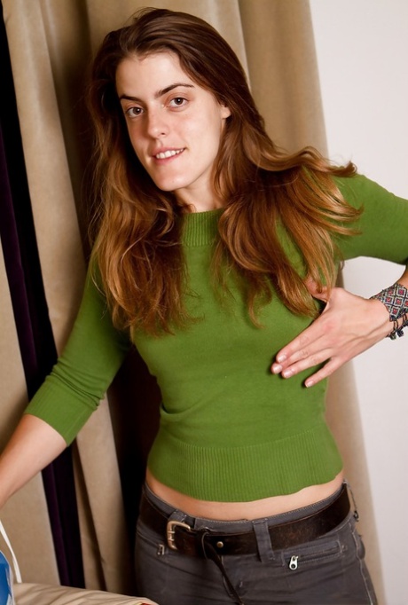 Slutty babe with hairy armpits stripping and spreading her legs