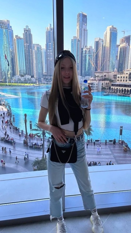 Charming blonde young adult Katya Sun takes numerous self shots in SFW mode