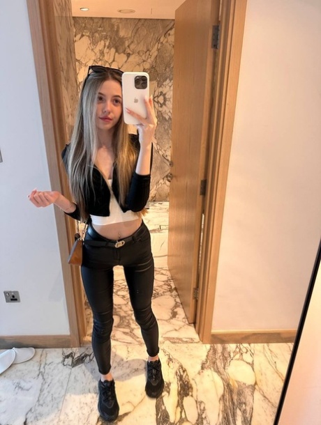 Charming blonde young adult Katya Sun takes numerous self shots in SFW mode