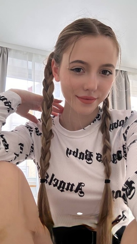 Charming blonde young adult Katya Sun takes numerous self shots in SFW mode