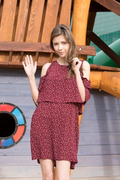 Naughty young adult Mila Azul shows her beautiful breasts & her shaved femininity outdoors