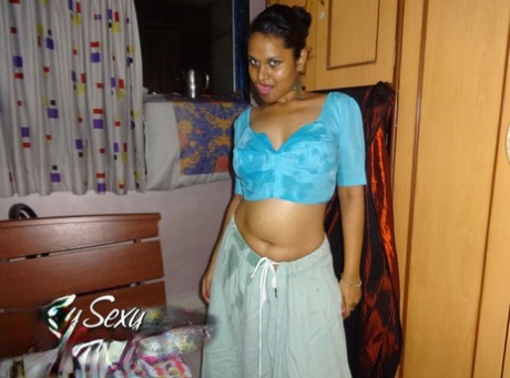 Indian solo girl Lily Singh exposes her natural breasts in a skirt