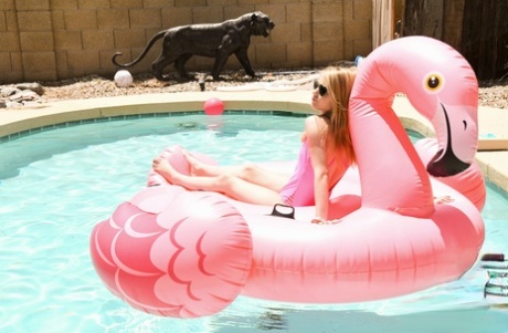 Petite young adult Hannah Hays frees her tight slit from pink swimsuit