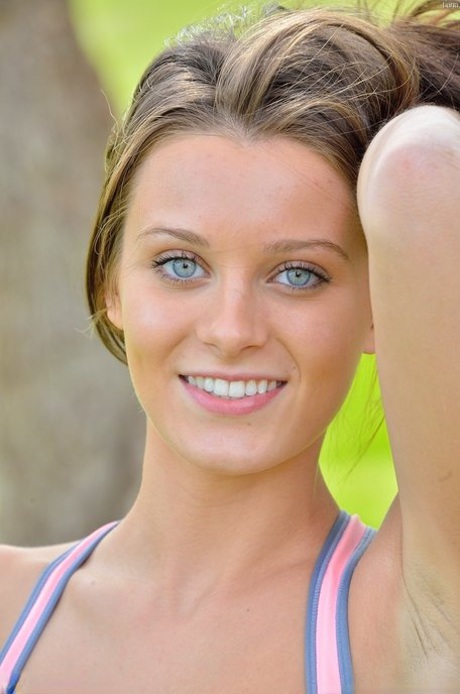 Petite blue-eyed brunette Lana strikes alluring artistic poses outdoors