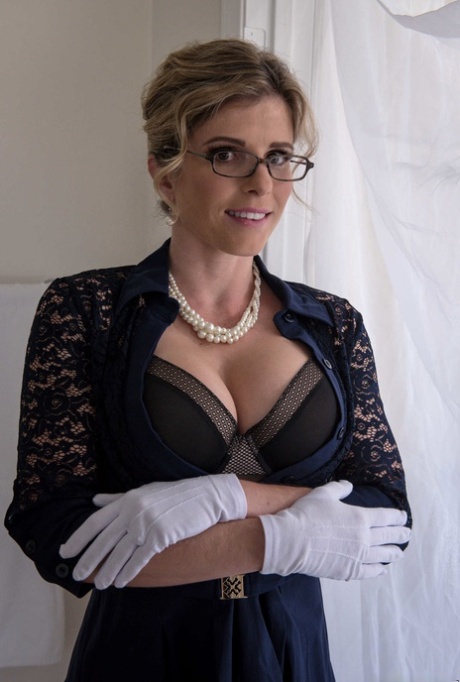 Nerdy MATURE WOMAN Cory Chase doffs her dress and flaunts her great fake breasts