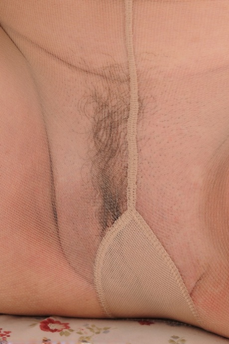 Smiley mature Jenna Covelli displays long hard nipples & femininity in pantyhose