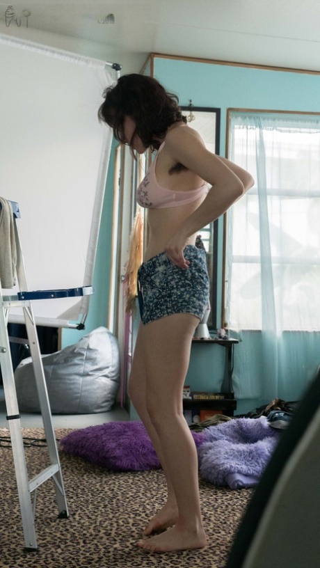 Slender Charlee shows nice breasts and thick underarm hair while getting dressed