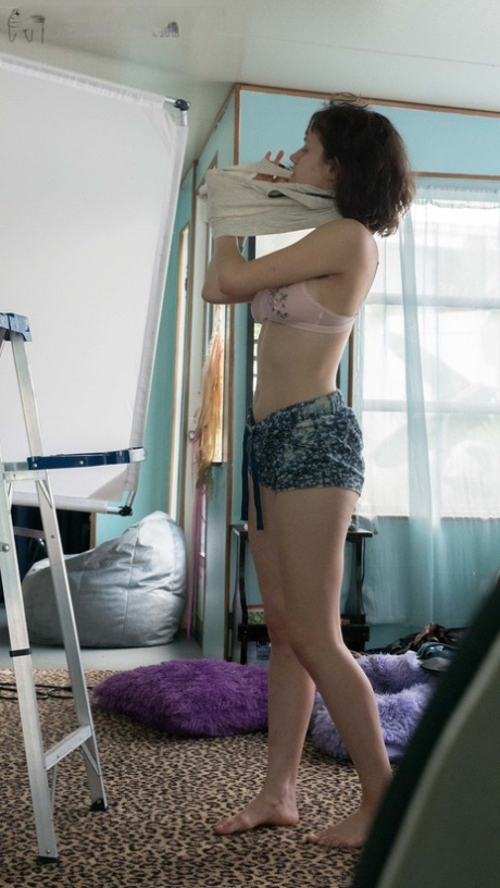 Slender Charlee shows nice breasts and thick underarm hair while getting dressed