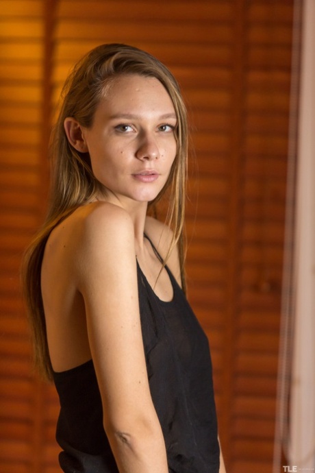 Comely young adult Mirabella is in mood to touch her bald cunny with pinwheel