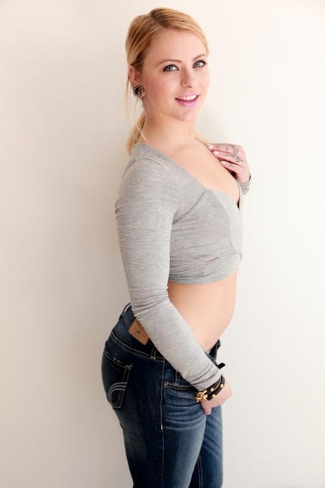 Blonde woman Cameron Canada slipping big white curves out of denim jeans