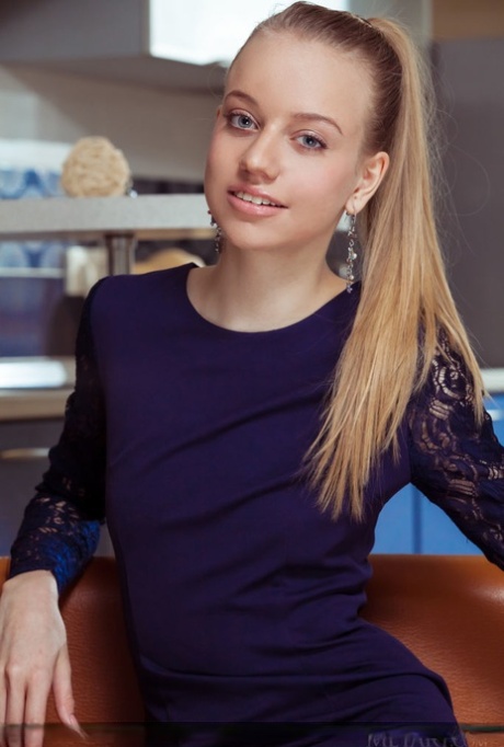 Skinny young adult girl Kimberly Kace shows her bald femininity with legs spread wide open