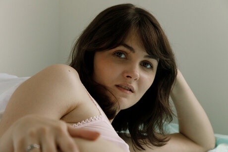 Alluring babe Onna Metcalf unleashes her small breasts and trimmed femininity too