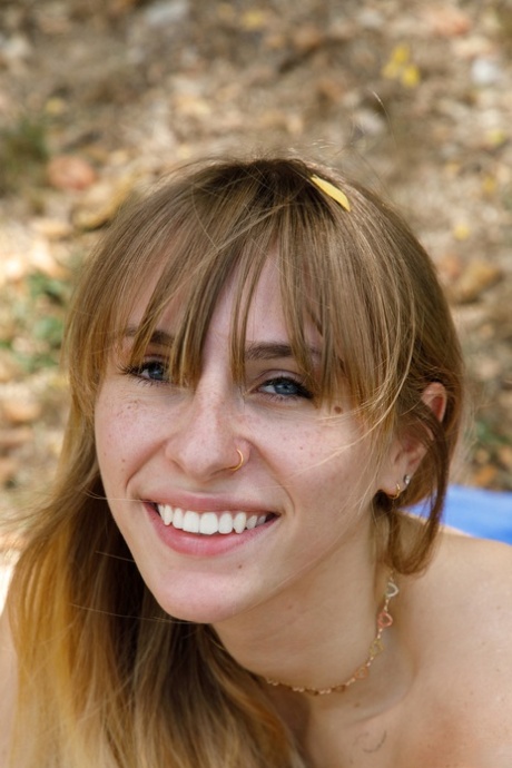 Charming babe in booty shorts Angel Youngs shows off her juicy breasts outdoors