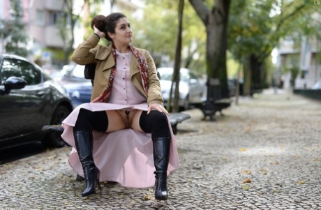 Cute authentic mom Lili flashes her muff as she poses pantyless in public