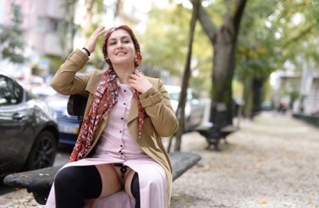 Cute authentic mom Lili flashes her muff as she poses pantyless in public