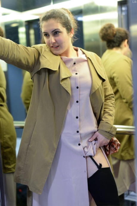 Cute authentic mom Lili flashes her muff as she poses pantyless in public