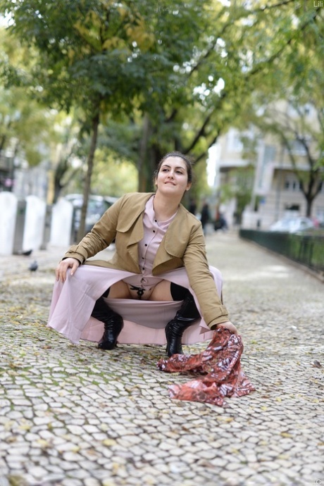 Cute authentic mom Lili flashes her muff as she poses pantyless in public