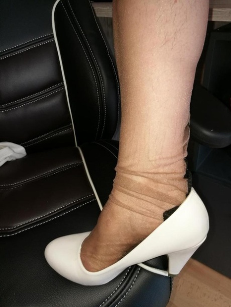 Horny oma sticks a Sharpie up her hairy vagina in back seam nylons