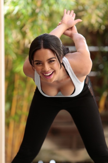 Petite brunette young adult with natural breasts Maya Bijou stretches and masturbates