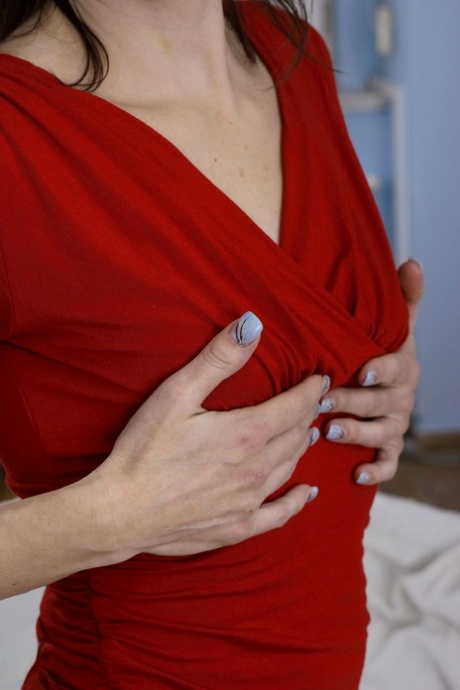 Cock-craving mature housewife Jalina C enjoying solo masturbation on a couch