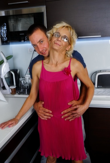 Thin housewife of advancing years gets banged by her toy boy in the kitchen