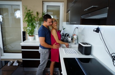 Thin housewife of advancing years gets banged by her toy boy in the kitchen