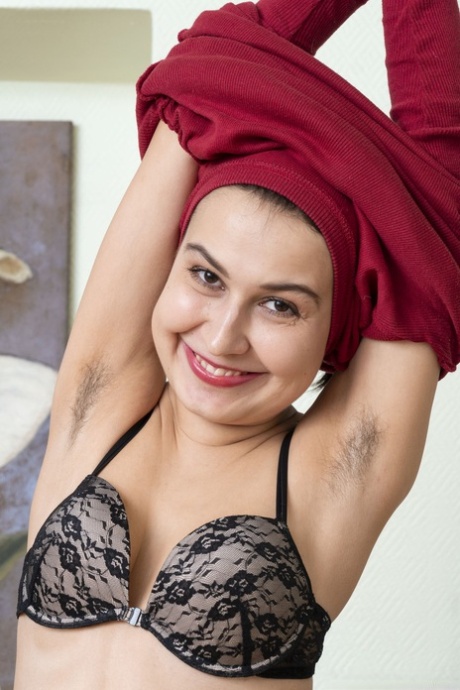 Dark haired young adult with hairy armpits Eva Black strips and toys her bush