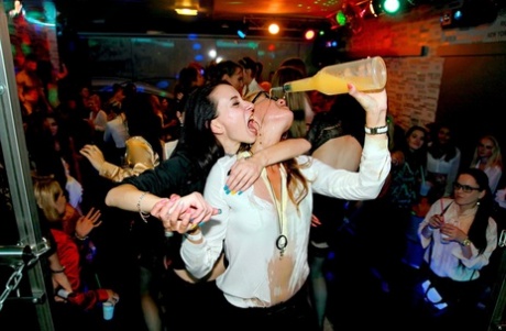 European chicks get soaked in booze at a party featuring male strippers