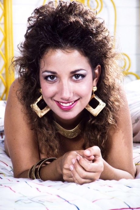 Babe with a hairy snatch Devon Daniels licking her monster breasts in bed