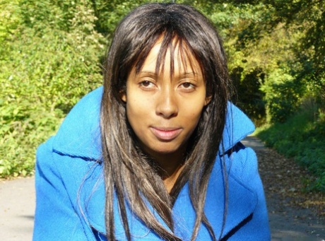 Ebony chick fingers her femininity on roadway while a jogger passes by