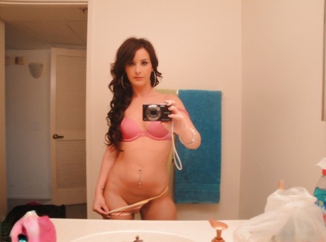Barely legal young adult Mia Valentine taking natural mirror selfies while undressing