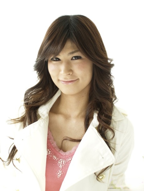 Clothed Japanese model Yuka Yamada shows her bare legs in a skirt