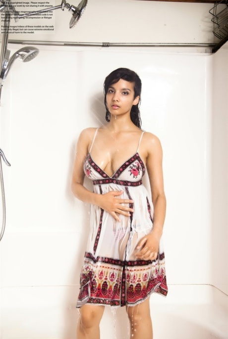 Indian solo girl takes off her wet dress to pose artistic in the bathtub