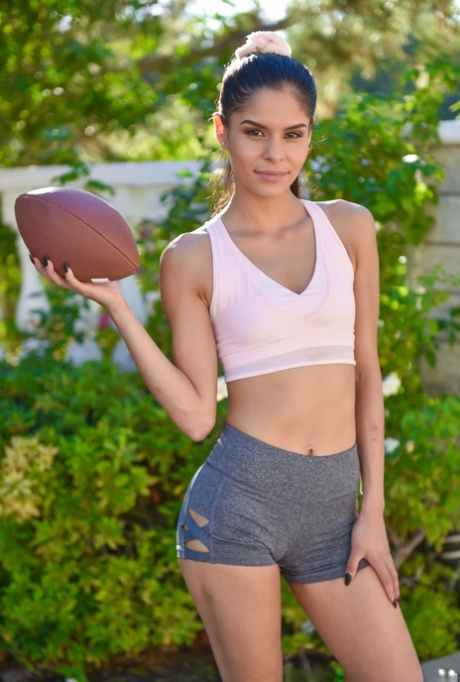 Attractive young adult Latina Katya Rodriguez undresses and flaunts her tight curves and femininity