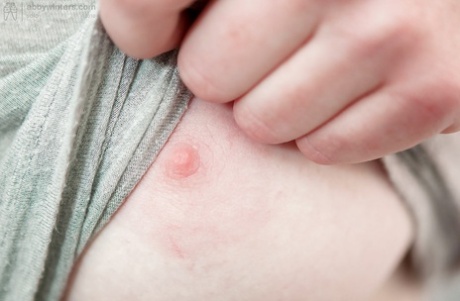 Redhead punk chick Isadora fondles all natural breasts and fingers hairy twat