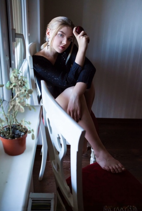 Erotic young Daniel Sea strips at her desk to spread her long legs wide open