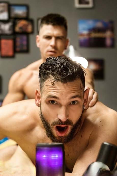 Ripped same-sex male men Paddy O'Brian and Enzo Rimenez bareback passionate on a couch