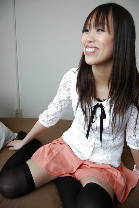 Smiley asian girl getting artistic and exposing hairy gash in close up