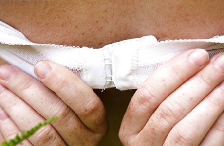 Chubby girl with freckles and big natural breasts spreads hairy cunt outside