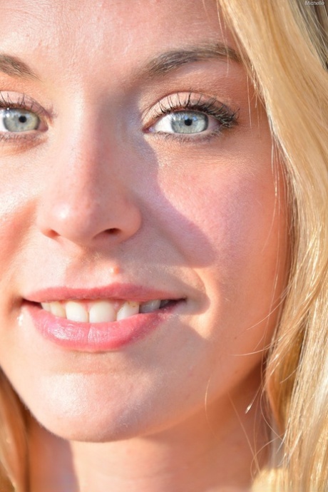 Glamour babe in a alluring dress Michelle flashing a pantyless upskirt in public