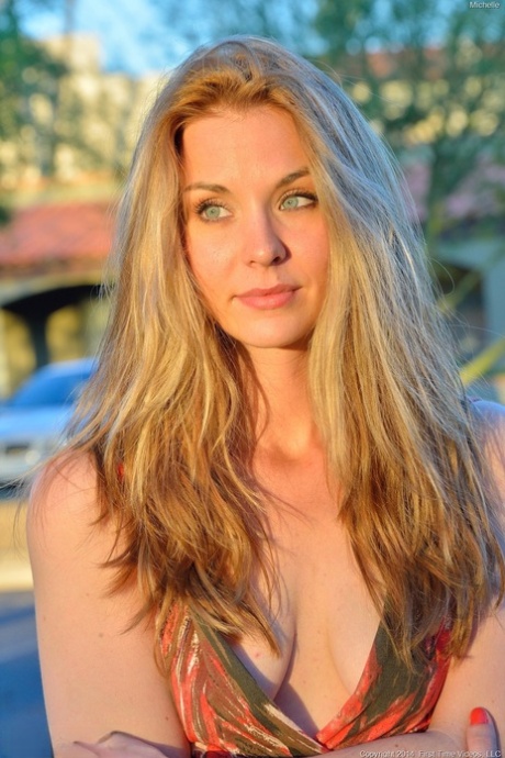 Glamour babe in a alluring dress Michelle flashing a pantyless upskirt in public