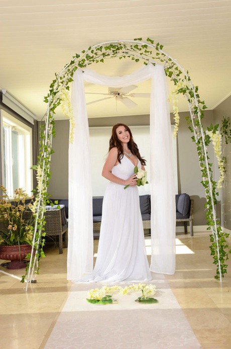 Buxom bride Angela White lets out her huge breasts and flashes her fat curves