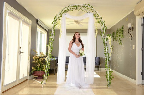 Buxom bride Angela White lets out her huge breasts and flashes her fat curves