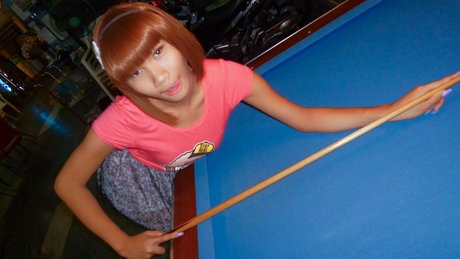 Red-haired Asian ladyboy lifts dress up to flash manhood in public place