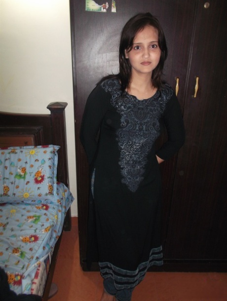 Attractive Indian model in tight jeans posing seductively in alluring lace bra