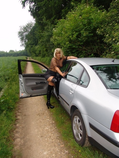 Mature woman Sweet Susi exposes herself in country lane wearing OTK boots